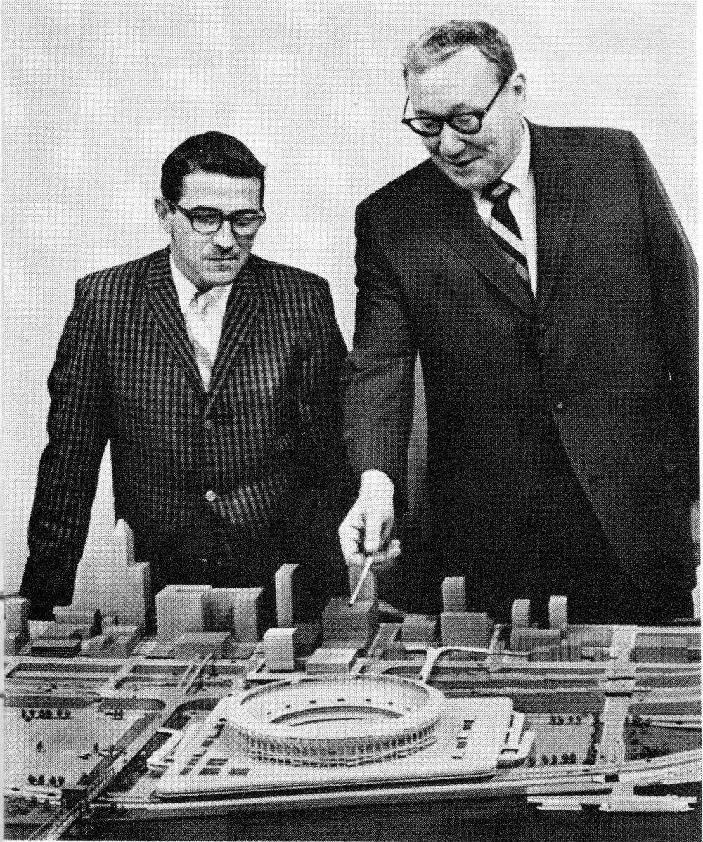 Black and white photo of Don Wehmeyer and Wallie Power with a model of Riverfront Stadium in 1969.