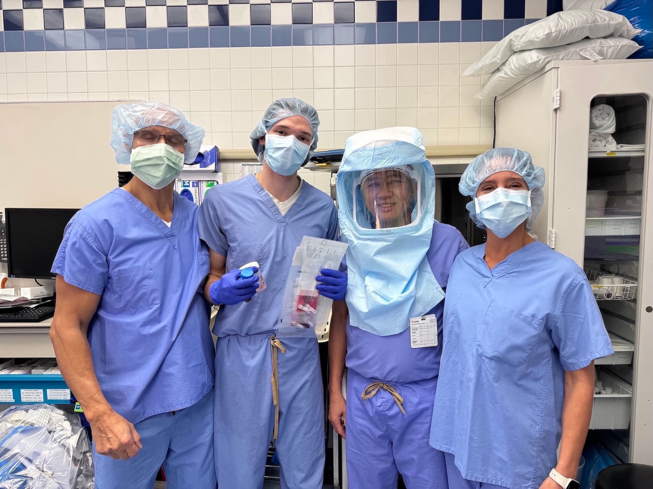 T. Toan Le and colleagues in operating room for clinical trial for prosthetic joint infections