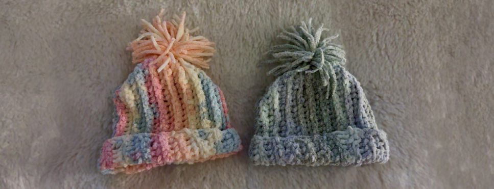 2 crocheted newborn hats