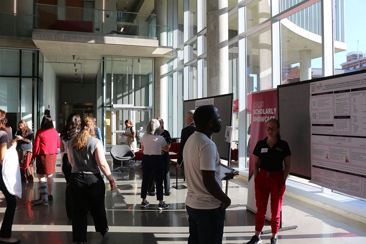 Health Sciences Building atrium with posters and students during showcase