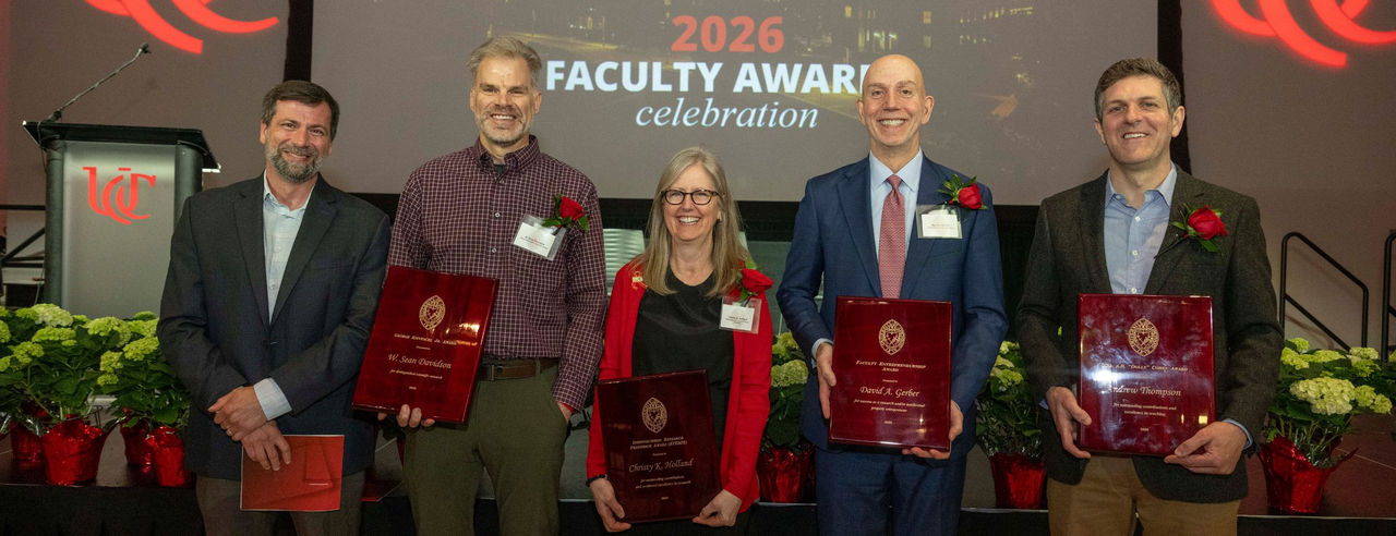 The five University of Cincinnati College of Medicine faculty members who were honored at the 2026 All-University Faculty Awards celebration pose with their awards