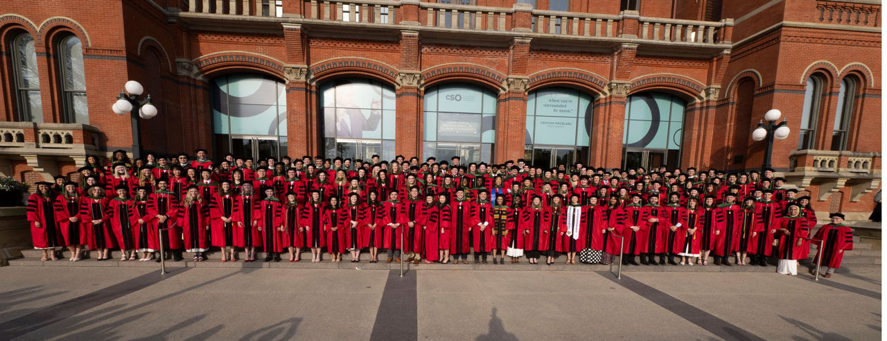  The UC College of Medicine graduating Class of 2026 poses for a group photo in front of Music Hall