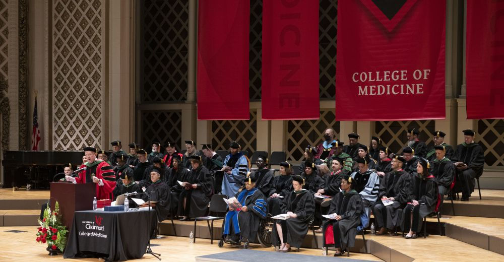 Gregory C. Postel, MD, gives opening remarks at the podium at Music Hall during the Honors Day graduation ceremony 
