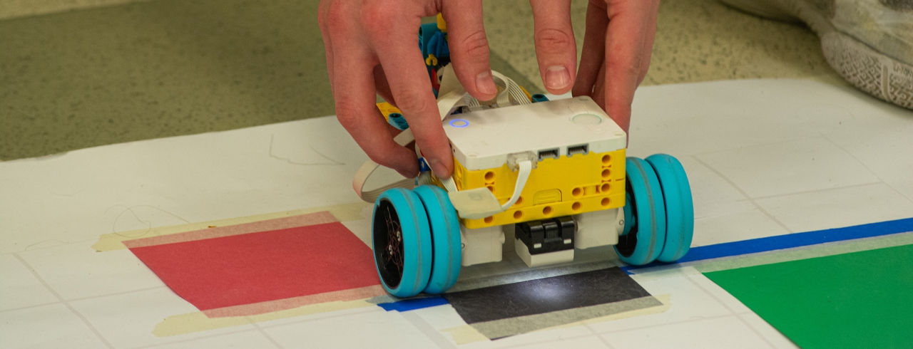 Students build LEGO robots as part of the annual robotics competition