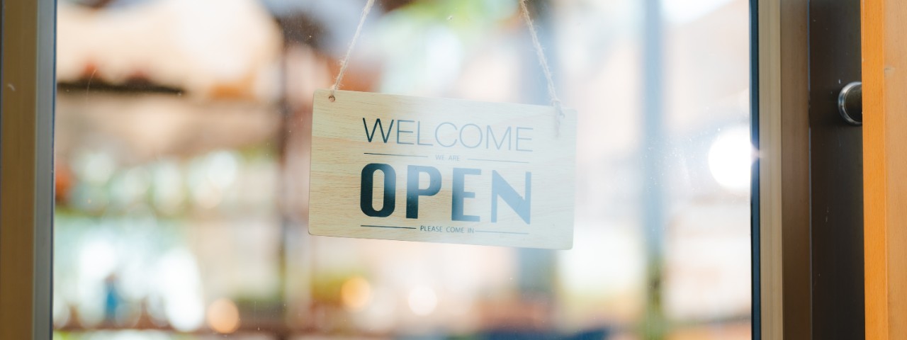 A storefront with an open sign
