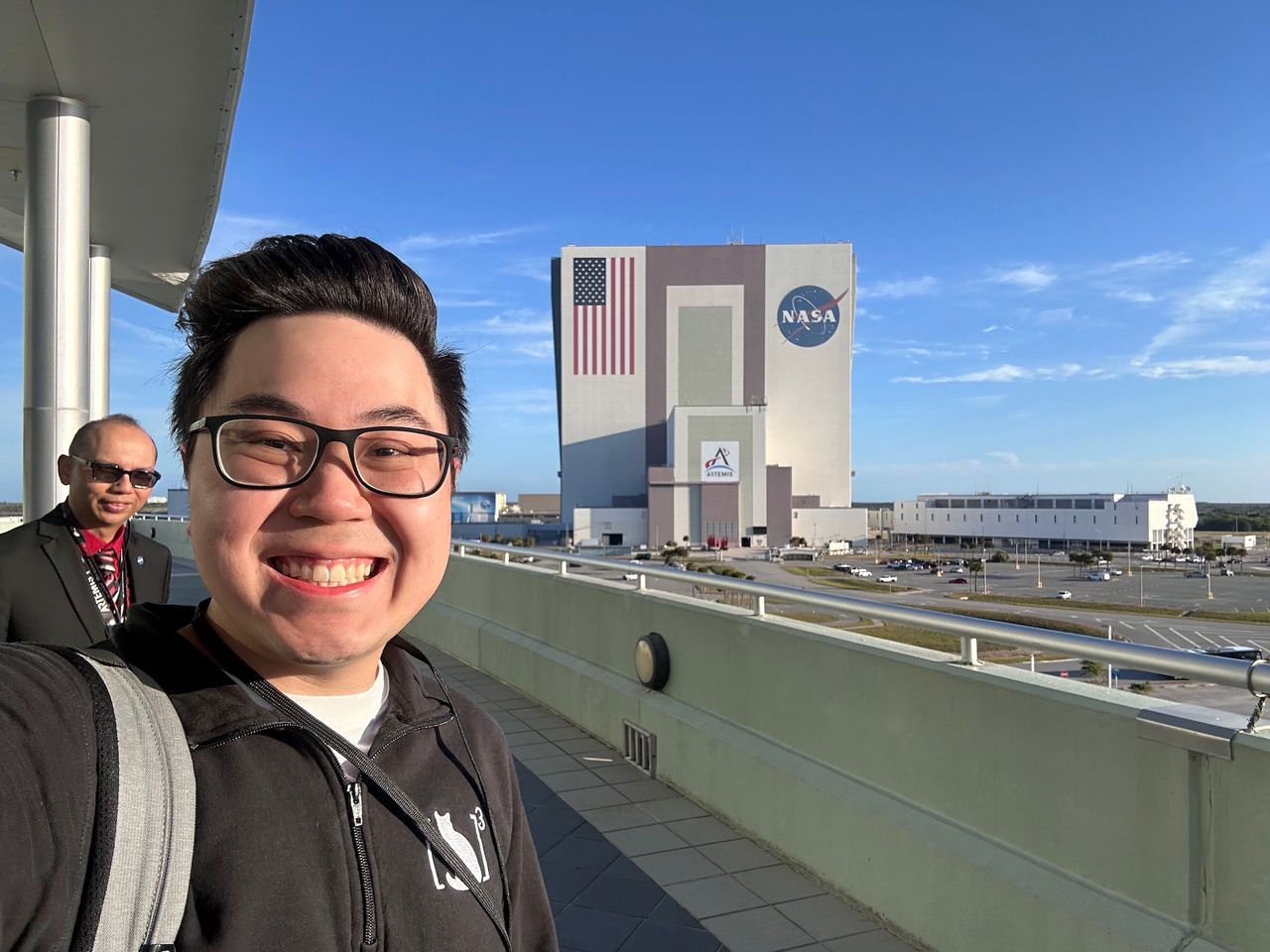 Nathan Nguyen in front of the NASA launch center. 