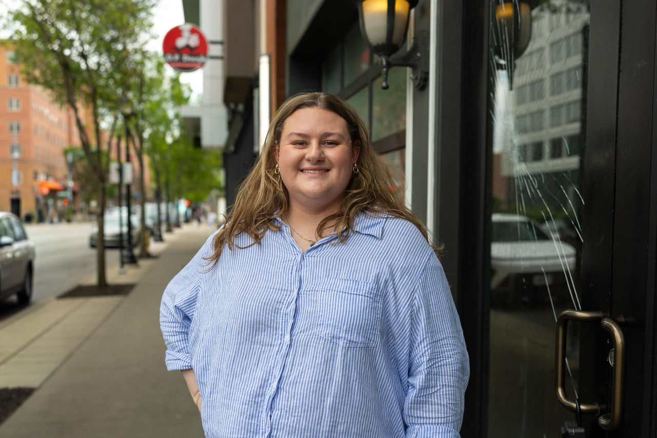 University of Cincinnati geography student Hannah Dahlke, pictured on McMillan Avenue in Cincinnati, reviewed maps of restaurant closures across Cincinnati neighborhoods.