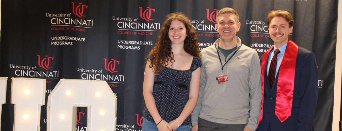 Kate Carey; Andrew Thompson, PhD; and John Jones celebrate Spring 2026 commencement