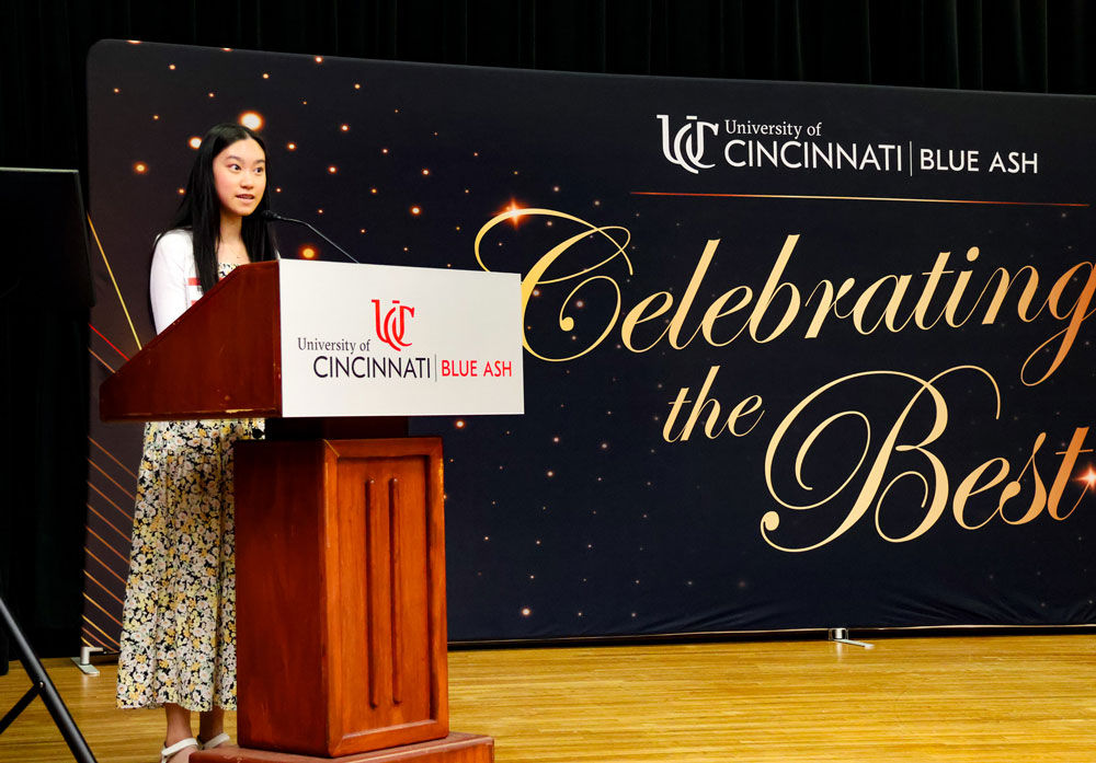 student Elizabeth Luong speaking at a lectern at Celebrating the Best ceremony