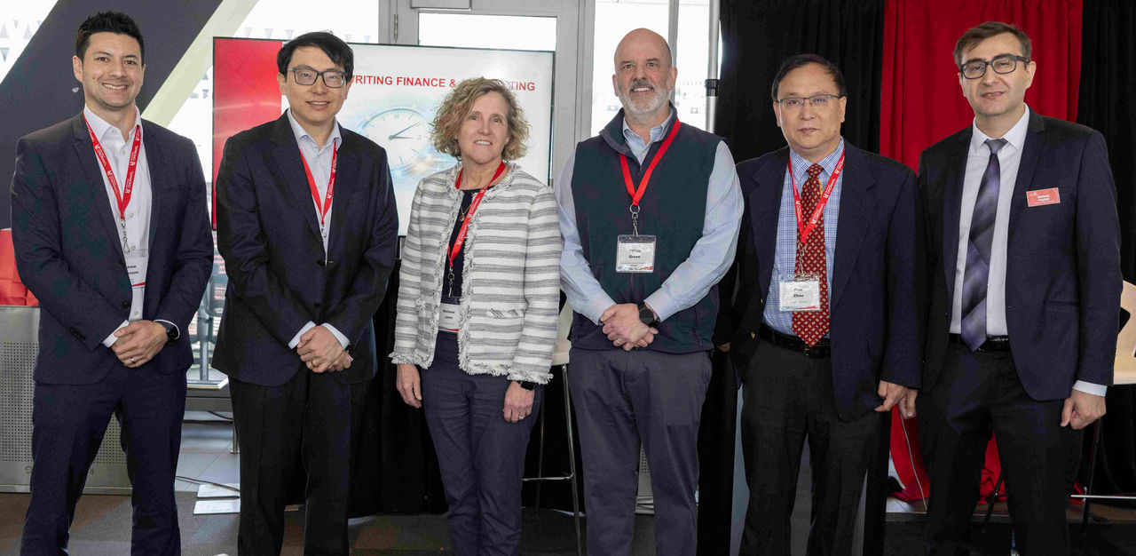 Members of the Johnson Investment Institute and Lindner accounting pose with Symosium speakers