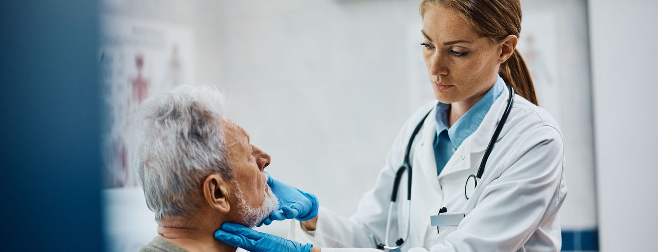 Nurse practitioner examines a male patient