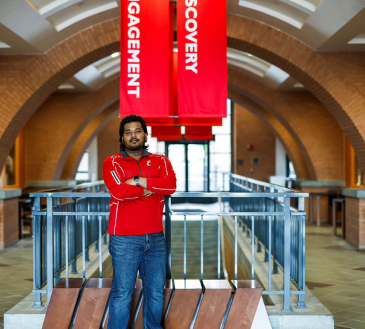Arvish Pandey shown in the atrium of UC's Mantei Center.  