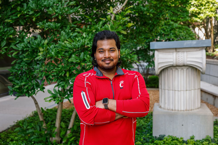 Arvish Pandey in a courtyard at Lindner College of Business