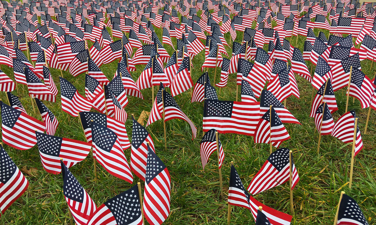 Hundreds of American flags cover the grass of University Commons.