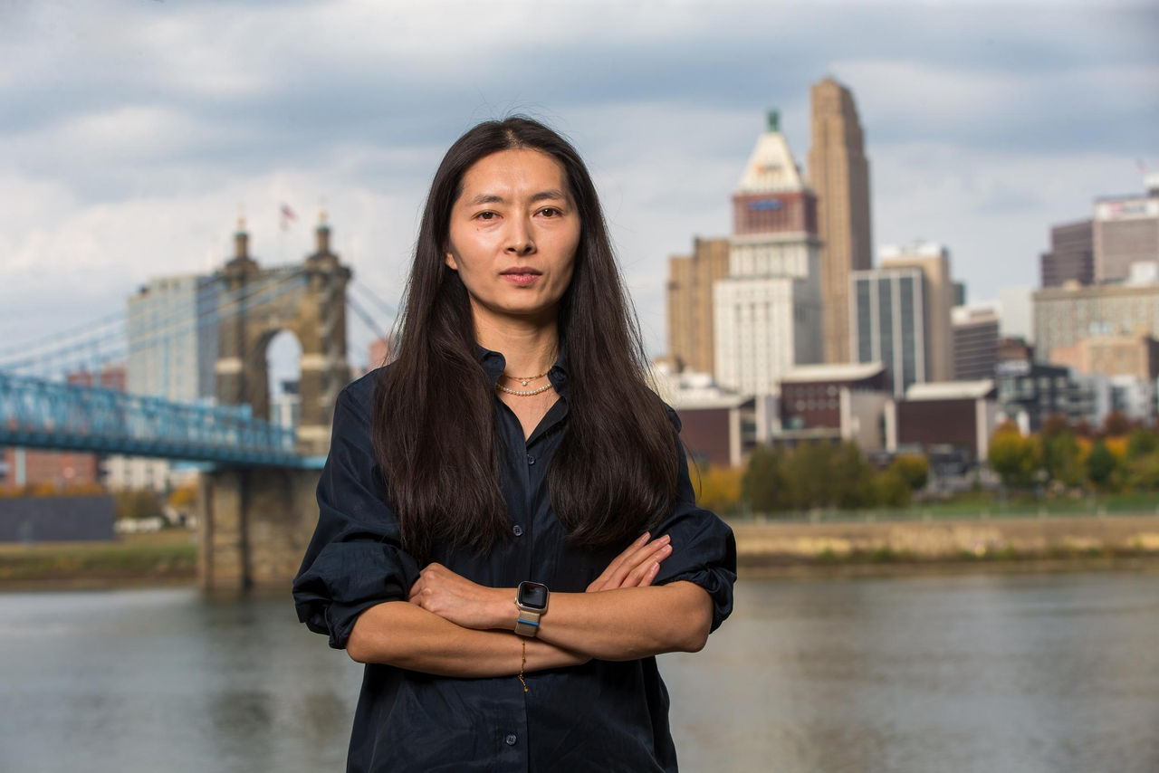 Portrait of Dongmei Feng on the banks of the Ohio River.