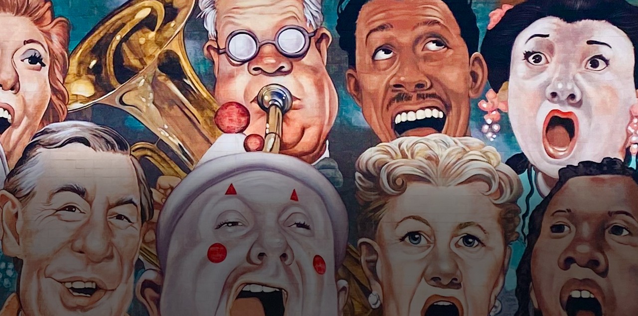 Featured image at the top: The Singing Mural, designed by nationally renowned artist and Cincinnati resident C. F. Payne, this cast of characters represents the community coming together in celebration of the arts.