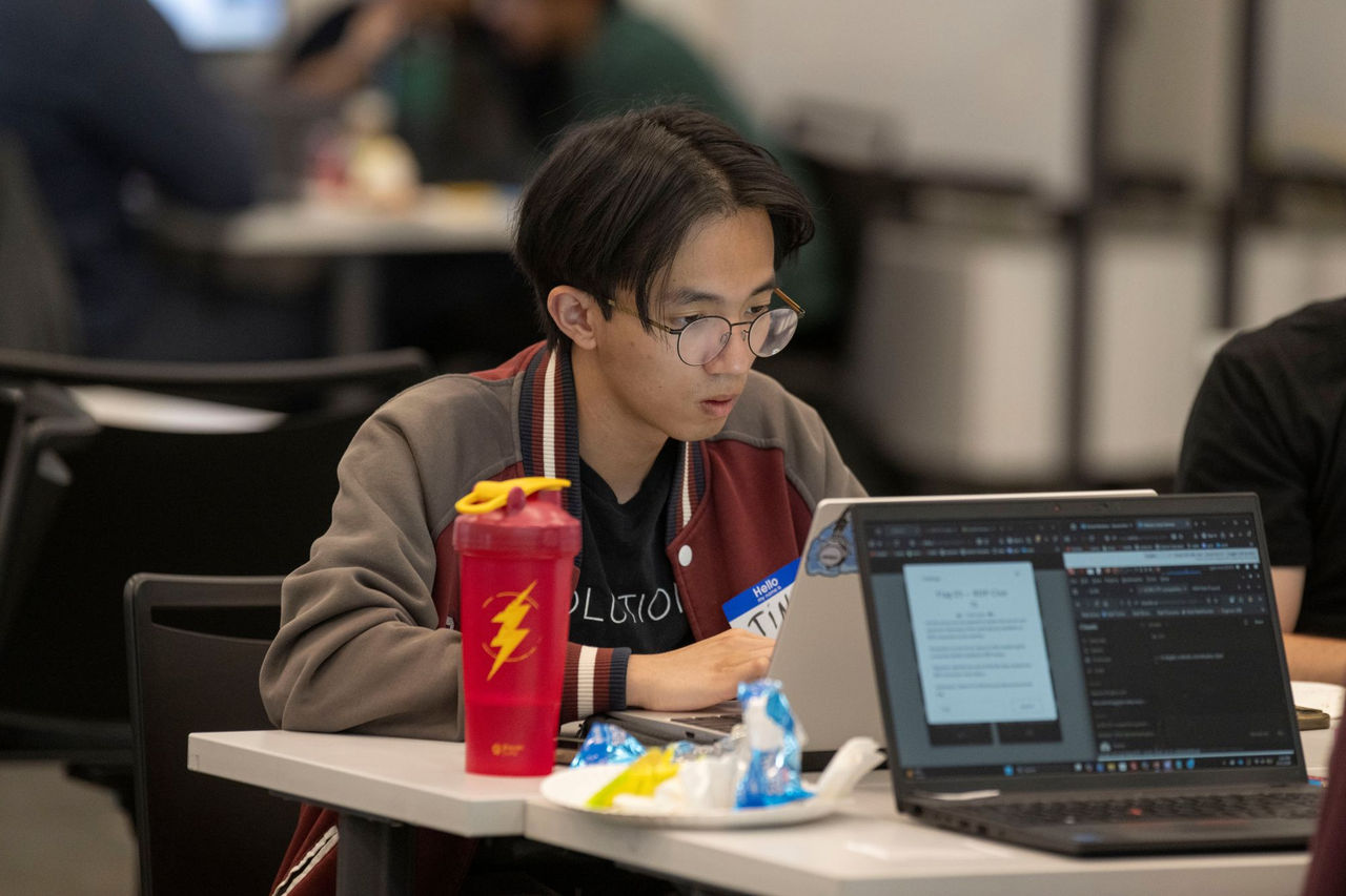 Student sits at a laptop  at OCRI's annual Capture The Flag event