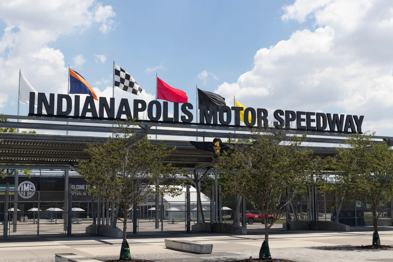 An entrance gate and sign for Indianapolis Motor Speedway. 