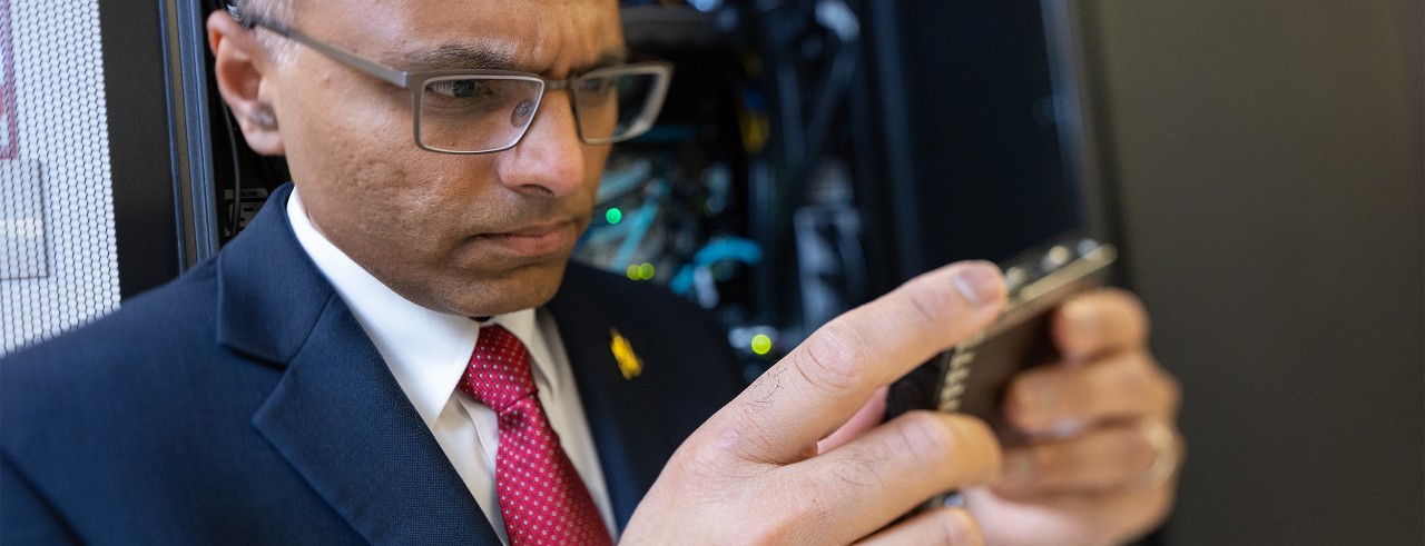 Prashant Khare holds a small device 