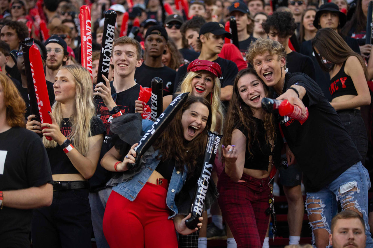 Students enjoy popcorn at a carnival.
