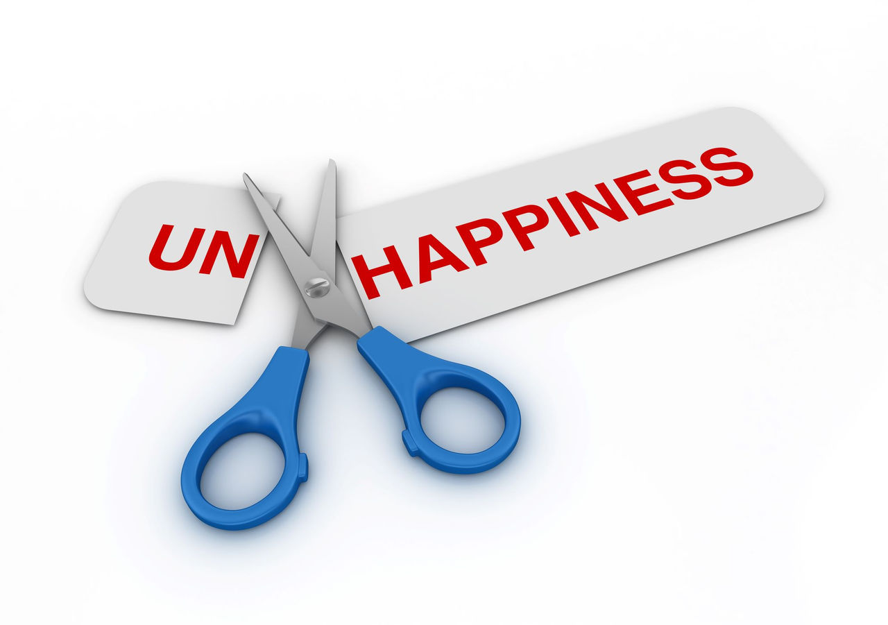The word: UnHappiness is shown with a pair of scissors using the 'Un' off the word.
