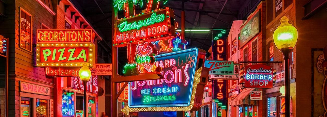 photo of the interior of the American sign museum crowded with neon signs