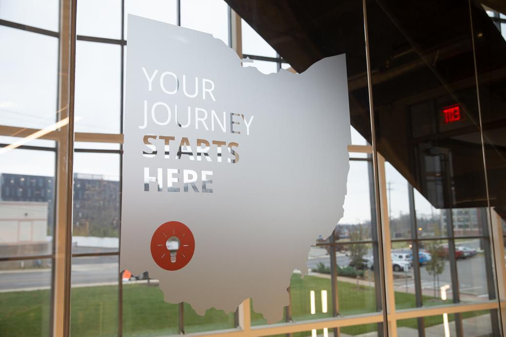 Signage with the state of Ohio that says "Your journey starts here"