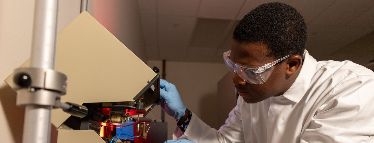 Philip Ochieze works in the lab