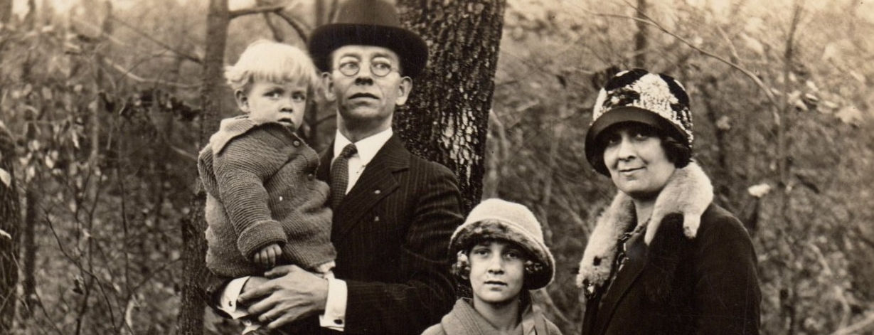 Four people in a black and white photo from the 1930s.