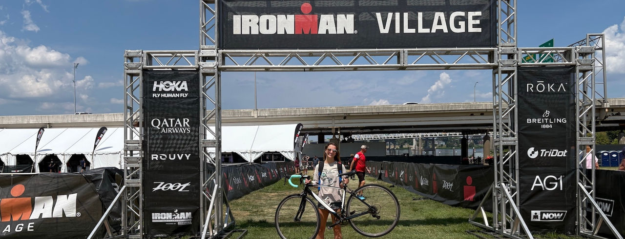 Mateja Rudmann holds her bike at the Ironman start line. 