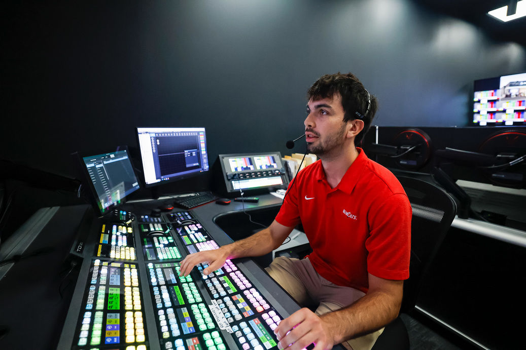 UC student in broadcast studio for partnership with ESPN