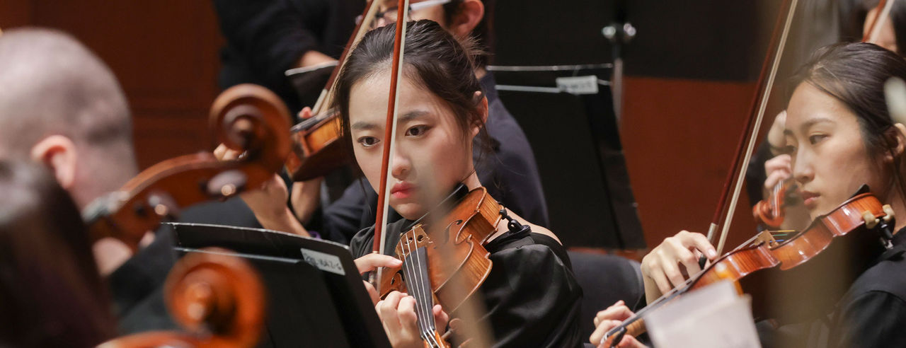 CCM Philharmonia performs on stage. 