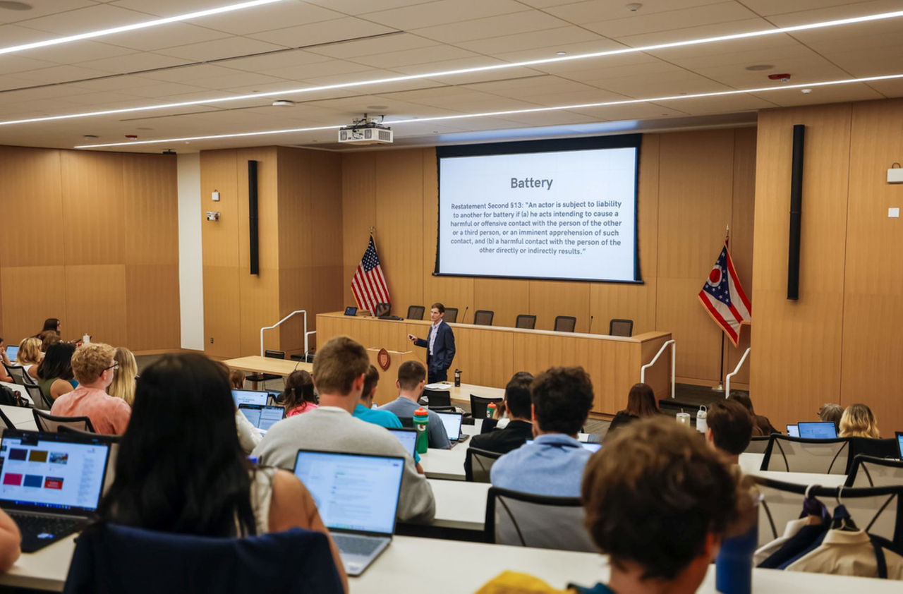 Students crowd a lecture hall in the UC College of Law for a class on tort law