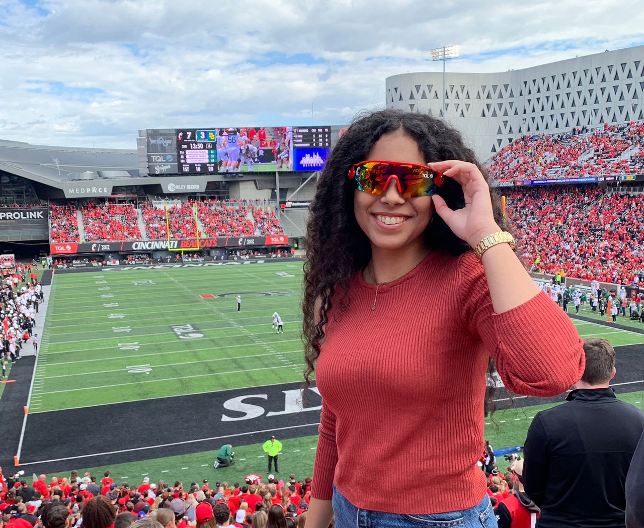 Woman standing in front of game at Nippert Stadium