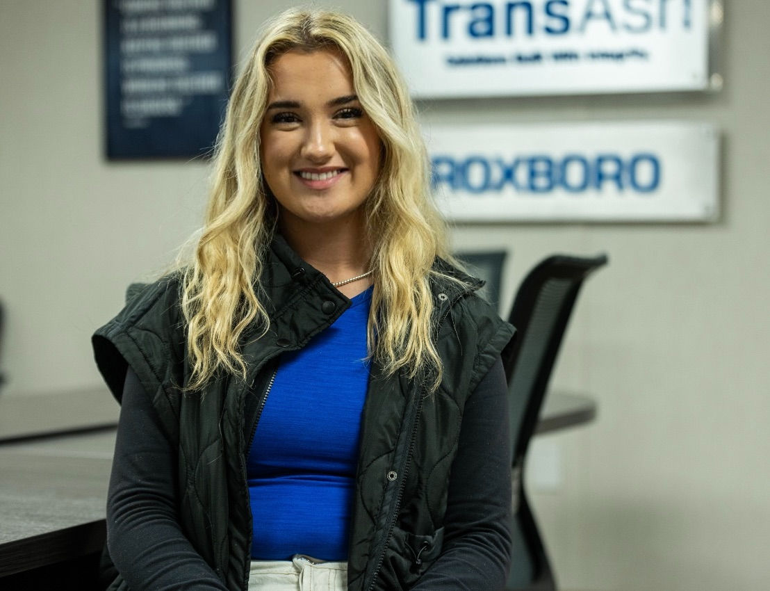 Smiling woman pictured in conference room