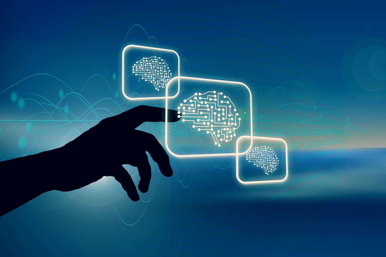 Illustration of a hand clicking on a digital screen with a pixelized brain on it. 