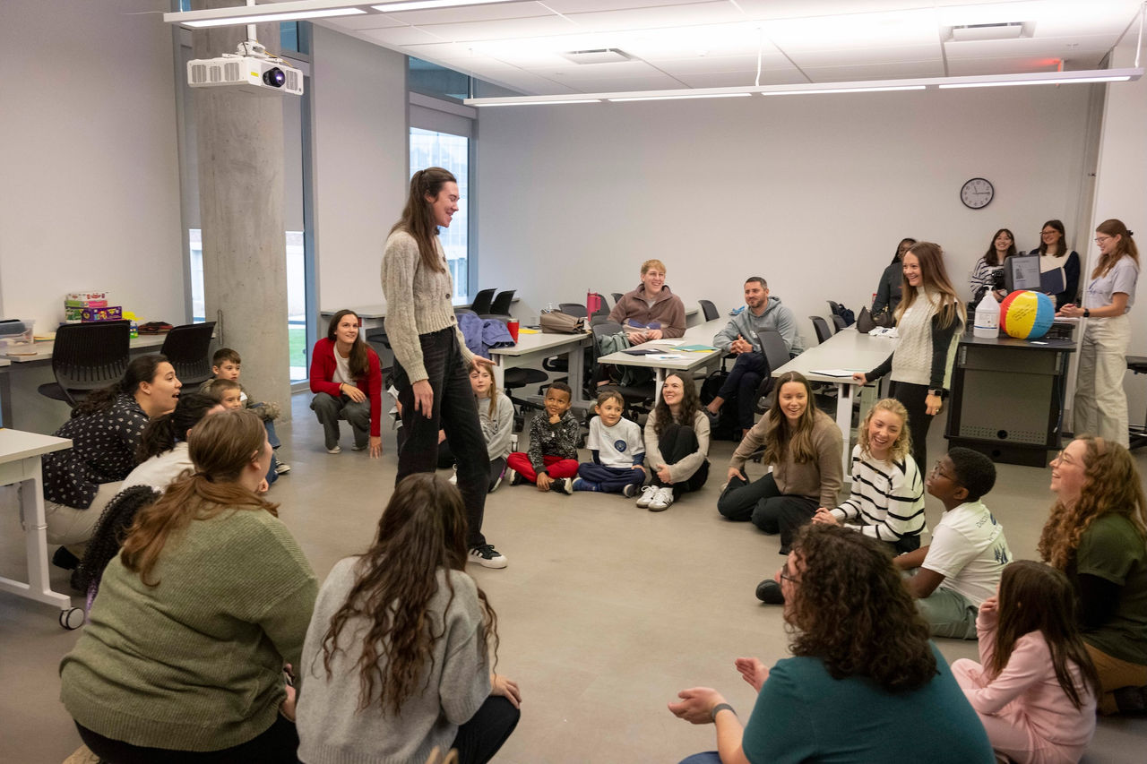 UC speech-language pathology graduate students and children participate in a group activity during STRIDE Cincinnati