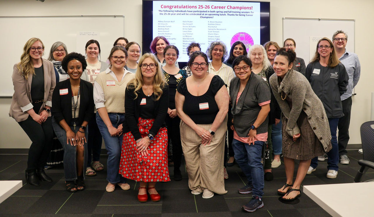 group of faculty and staff career chamipons posing together in a classroom