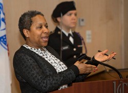 Debra Merchant, UC vice president for student affairs, speaks at charter-signing event.
