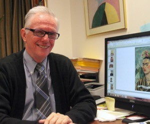 Carl Bryant sits at computer with Frida Kahlo slide on screen.