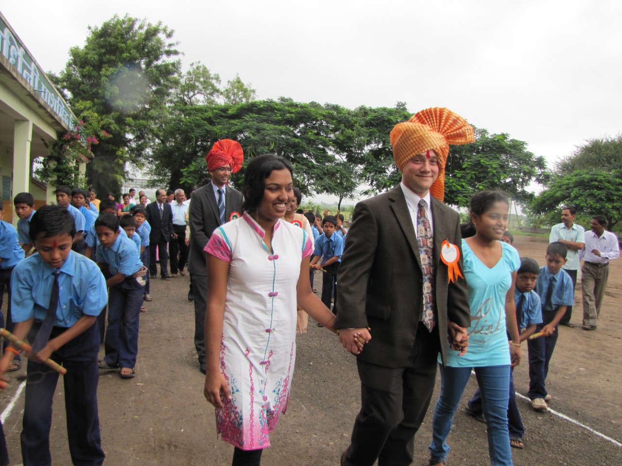 UC's Jon Weller walks hand in hand with Karishma Randhave and Anjani Lahane.