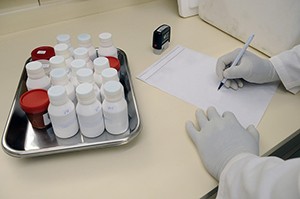 lab technician taking notes