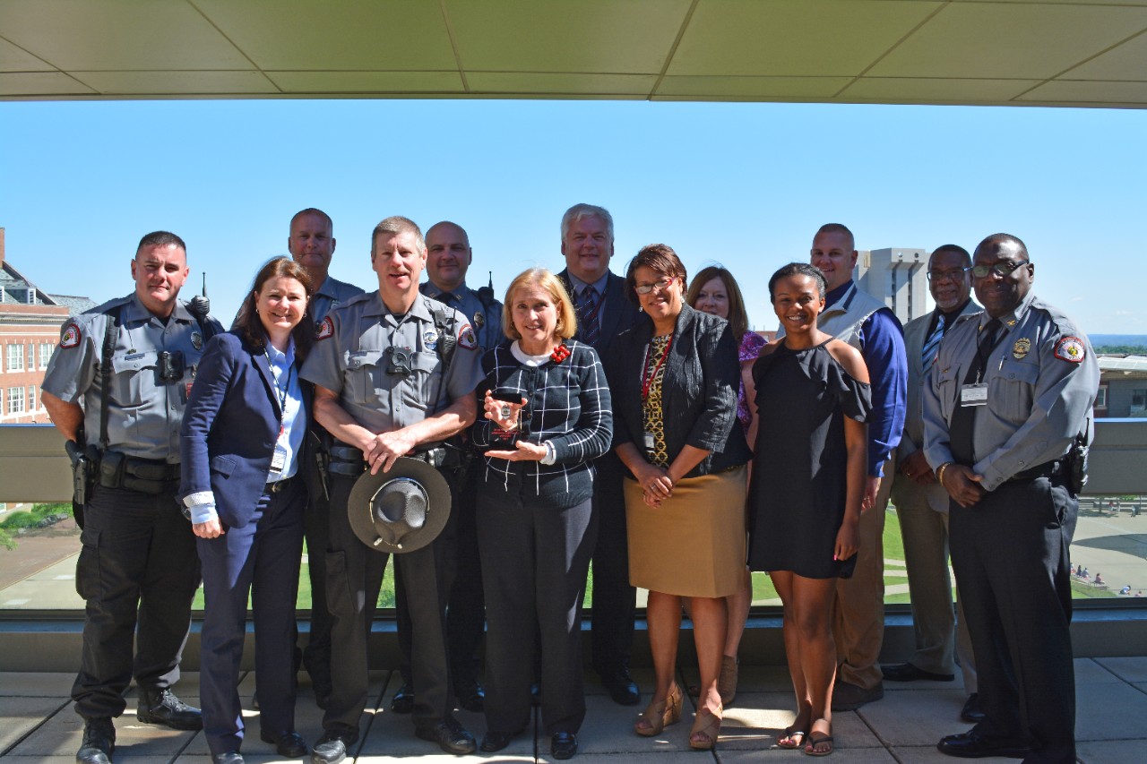 Professor Susan Bourke stands with members of the UCPD and the Department of Public Safety after receiving UCPD's first Annual Appreciation Award.