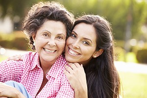 Mother and adult daughter embraced