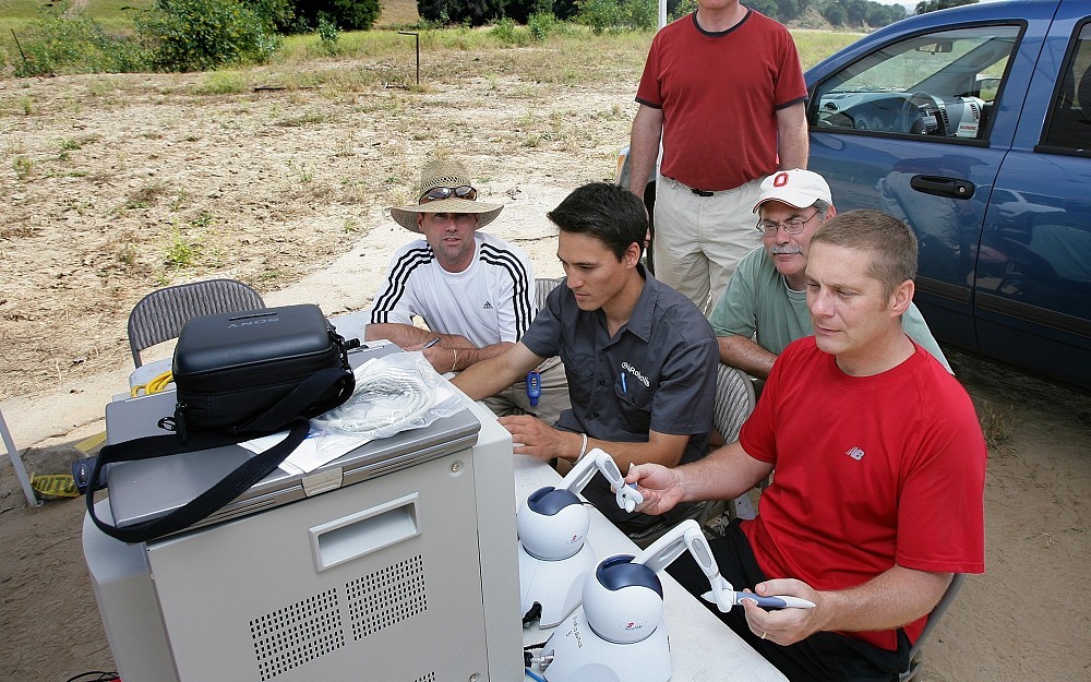Timothy Broderick, MD, (far right) and his team perform a robotic telesurgery simulation Simi Valley, California. 