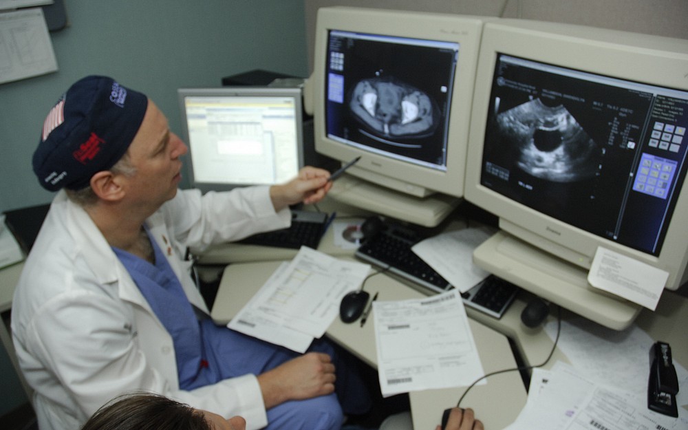 Darryl Zuckerman, MD, reviews a patient case prior to treatment. 