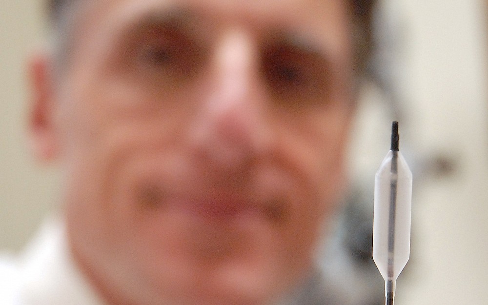 UC's Allen Seiden, MD, shows off the balloon and wire device that can bring relief to people suffering from sinusitis.