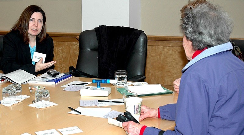 Sandra Starnes, MD, talks to a potential patient at UC's Community Cancer Education Day.