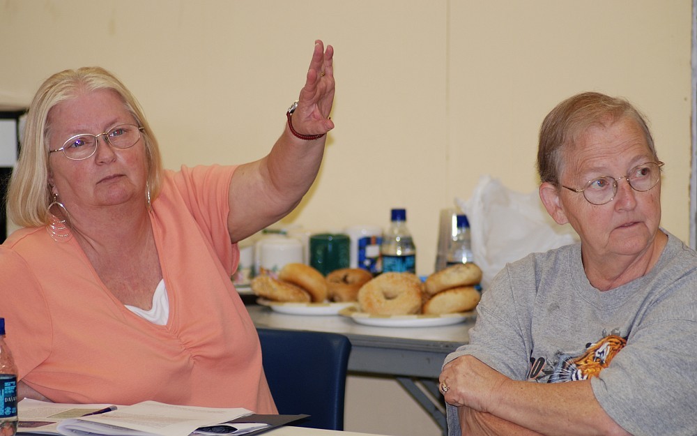 Pam Sala, left, and Linda Bryant, right, attend a class to learn about interactions between environmental exposures and common, genetic illnesses.