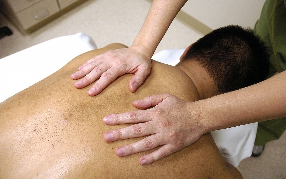 Heavy lifting and long lines can lead to back pain. 